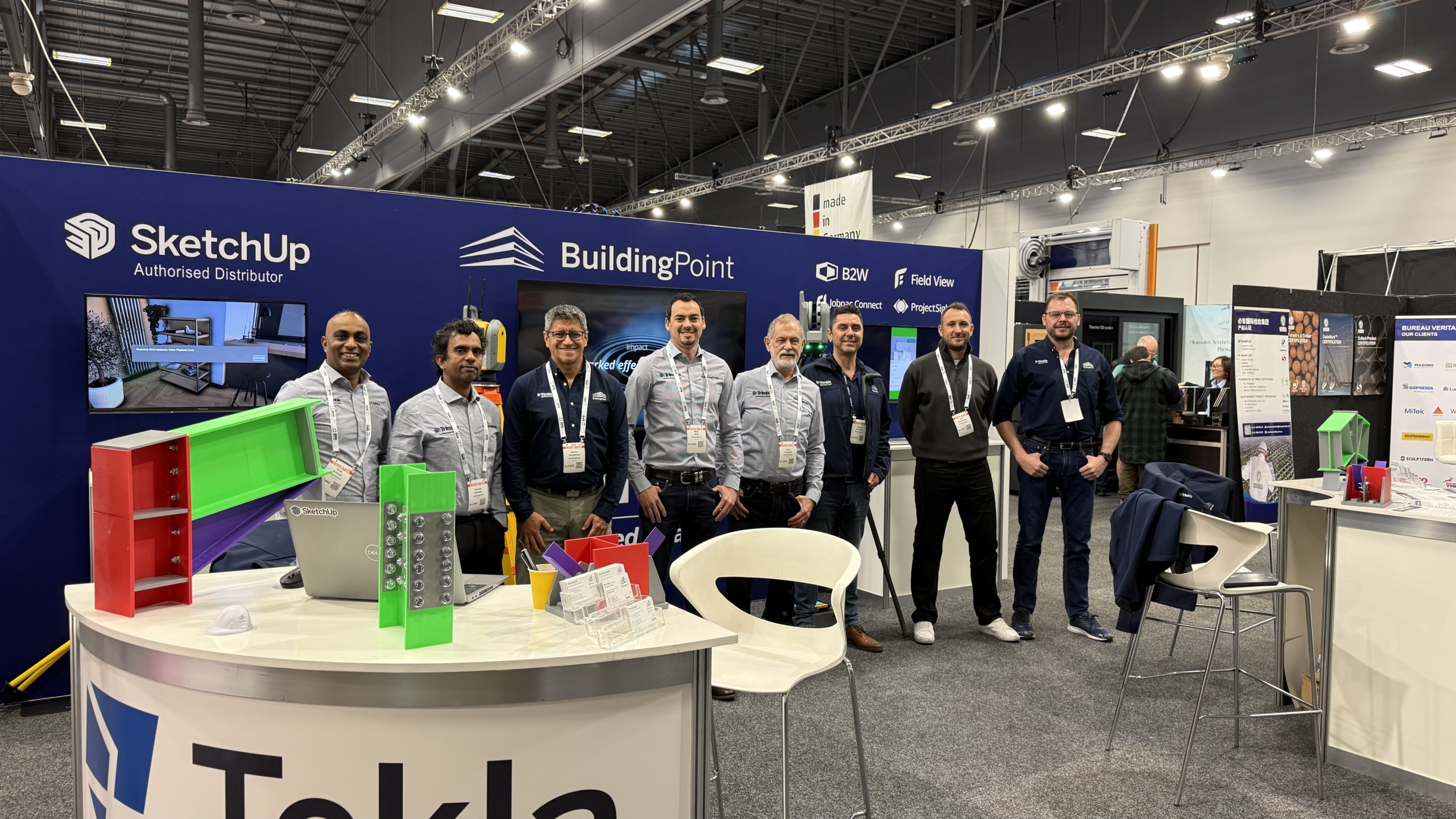 BuildingPoint New Zealand team members with SketchUp and Tekla branding at the BuildNZ stand